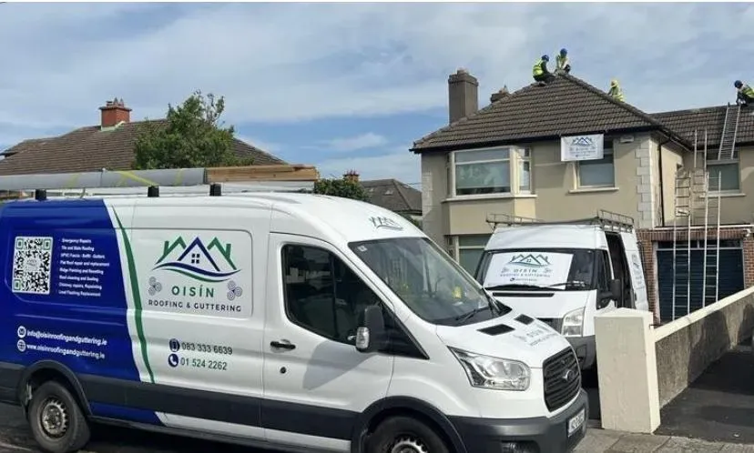 Oisin Roofing & Guttering marked van parked outside a Dublin house